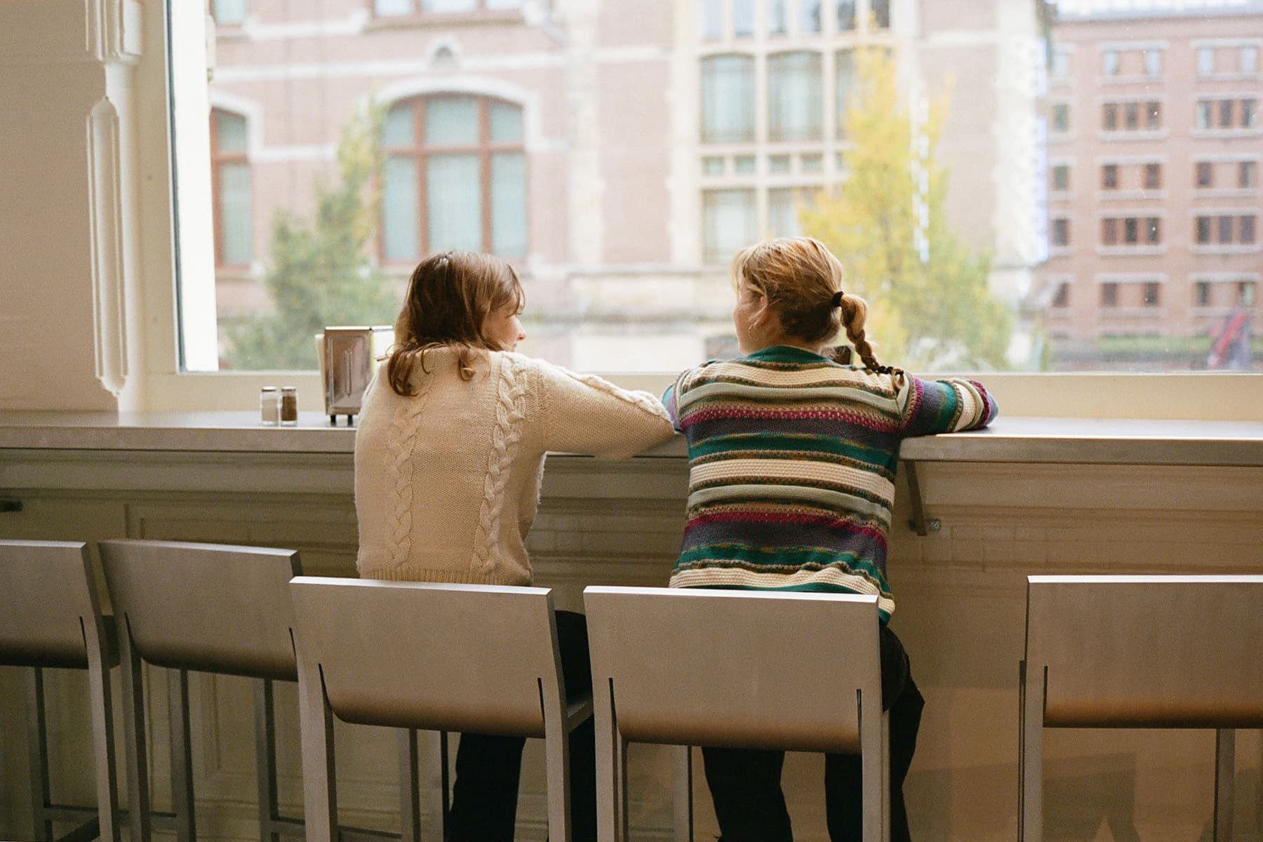 Two people sitting at the counter in Fonda Café